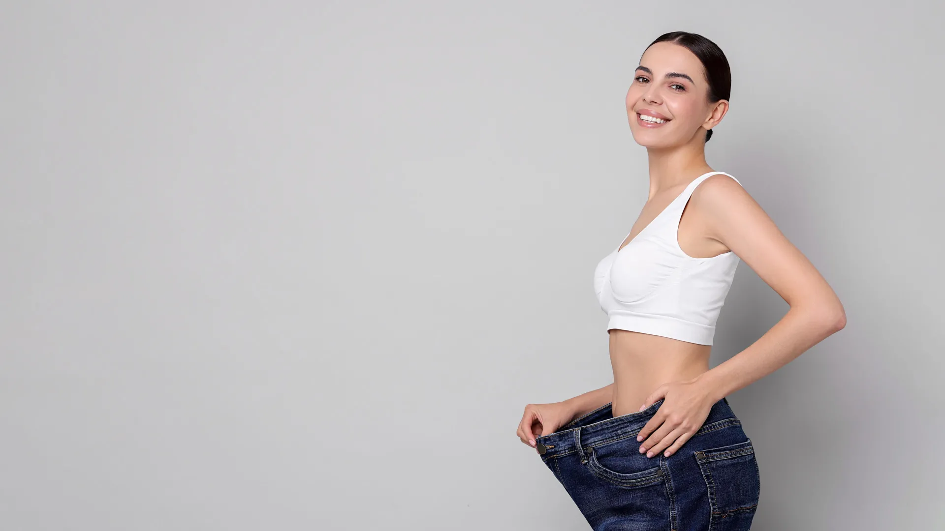 Woman celebrating weight loss results at iCRYO Okatie-Bluffton Medical Weight Loss program
